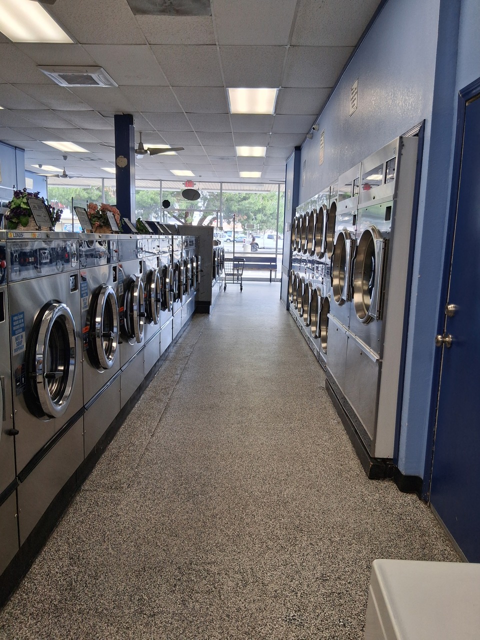 Aisle view of washers and stacked dryers at a clean, well-maintained laundromat in Hemet, CA Aisle view of washers and stacked dryers at a clean, well-maintained laundromat in Hemet, CA