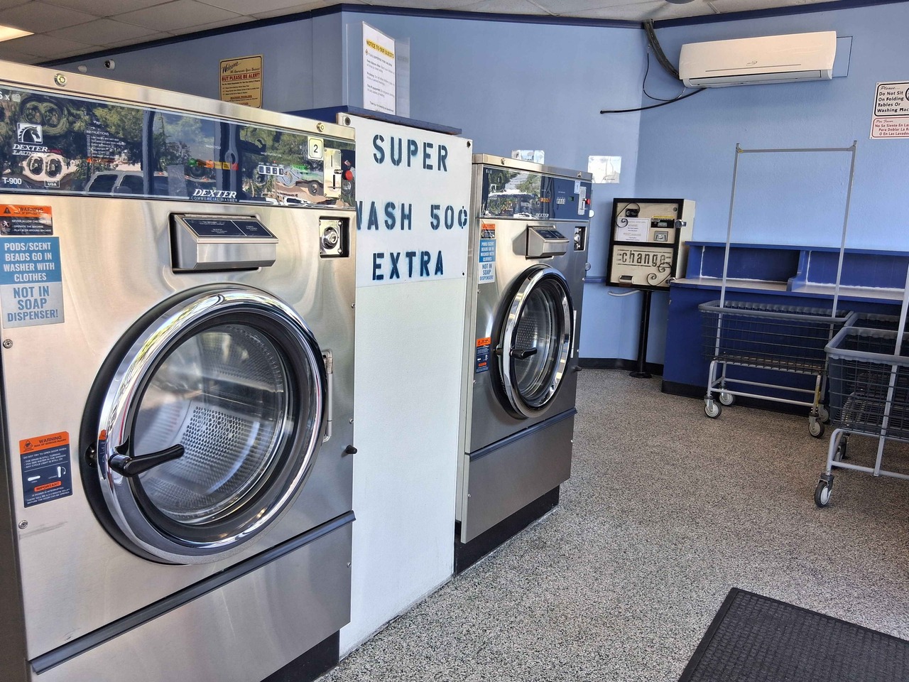 Large Dexter washers near the change machine at a clean, well-maintained laundromat in Hemet, CA Large Dexter washers near the change machine at a clean, well-maintained laundromat in Hemet, CA